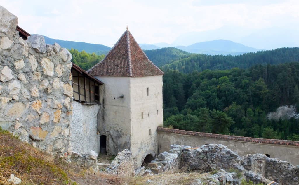 Rasnov stands watch over majestic forests.