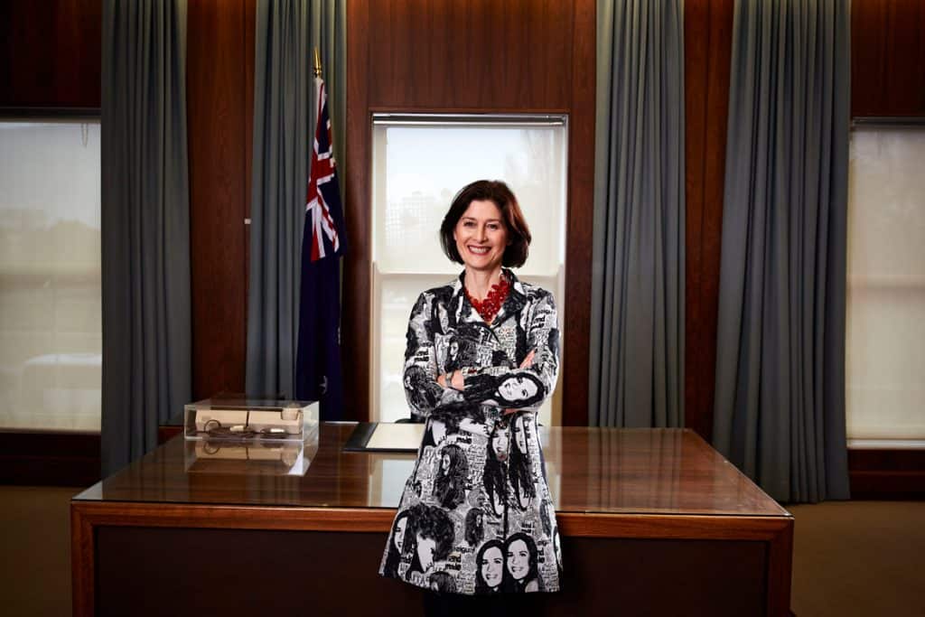 Daryl Karp, director of MoAD, stands in front of the prime minister's desk at Old Parliament House