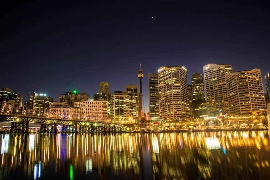 Brightly lit office towers overlooking Sydney's Darling Harbour